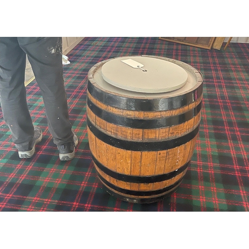 183 - A TALKING POINT! 
A large coopered oak barrel converted on castors with the intention to serve as fi... 