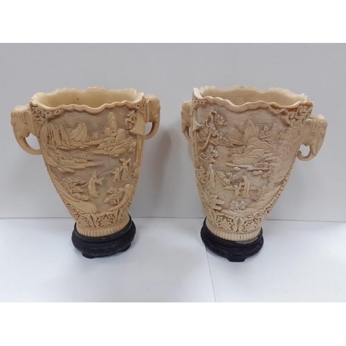 229 - A superb pair of large ceramic Chinese vases deeply carved and with Elephant head handles. Each stan... 