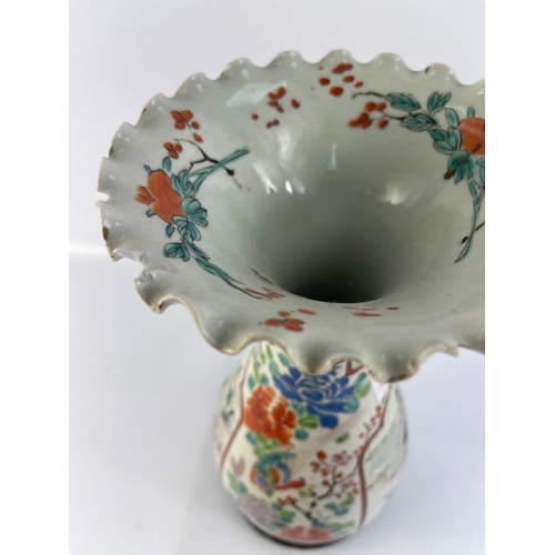 234 - An Oriental vase with fluted rim standing 30cm high with slight damage to rim on a wooden stand#38... 