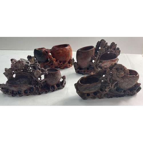 284 - A lovely group of Chinese red soapstone pieces.  Four have intricate floral designs in addition to p... 