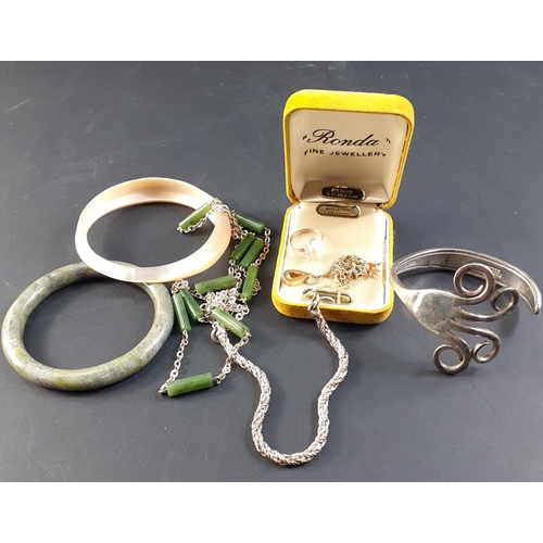 42 - VINTAGE! A small group of costume jewellery to include an EP fork made into a bangle, a green stone ... 