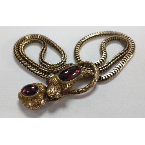 20 - VINTAGE! An unmarked yellow metal necklace with unusual fish pendant and two oval red stones. Gross ... 