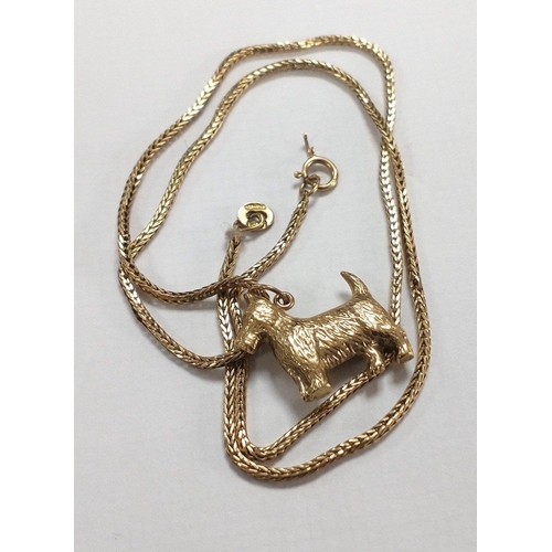 4 - A 375 marked gold chain with an unmarked yellow metal Scottie Dog Pendant.  Clasp and chain with dam... 