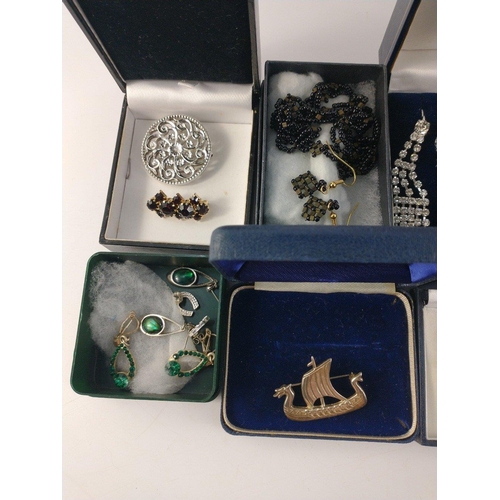 41 - A mixed collection of costume jewellery to include a pewter seahorse, necklace and earrings sets, sc... 