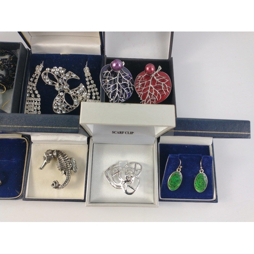 41 - A mixed collection of costume jewellery to include a pewter seahorse, necklace and earrings sets, sc... 