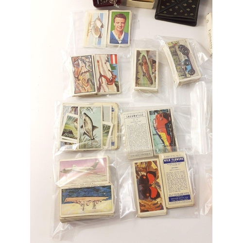 49 - A mixed box to include a tooled trinket box (8x6x4cm approx), various cigarette cards, a Edward VII ... 