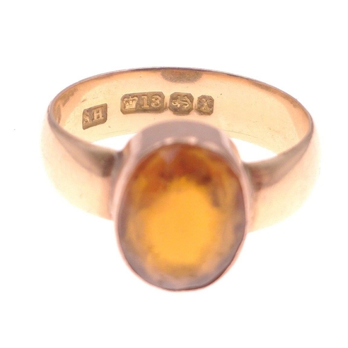 5 - An 18ct stamped dress ring hallmarked Birmingham to include a large oval orange stone. (Stone measur... 