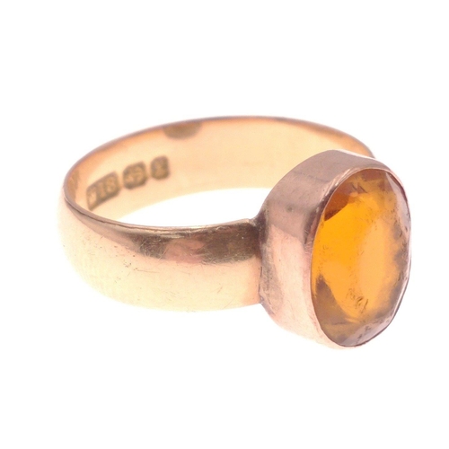 5 - An 18ct stamped dress ring hallmarked Birmingham to include a large oval orange stone. (Stone measur... 