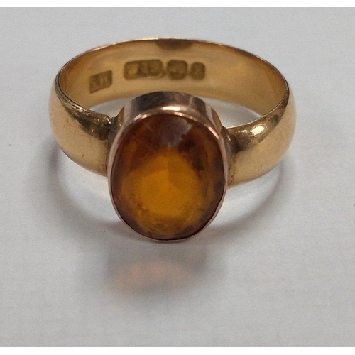 5 - An 18ct stamped dress ring hallmarked Birmingham to include a large oval orange stone. (Stone measur... 