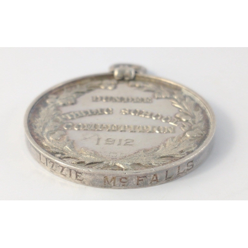 52 - 1912 DUNDEE PUBLIC SCHOOLS silver medal for Scottish Song.  Rubbed hallmarks 4cm diameter 27.5g#52... 