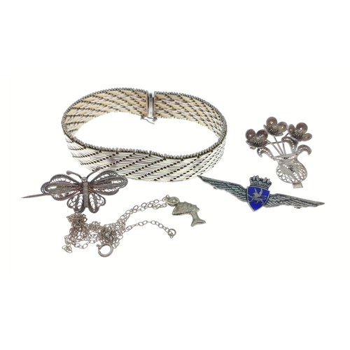 56 - A small collection of silver jewellery items to include crowned wing enamel brooch, an Egyptian styl... 