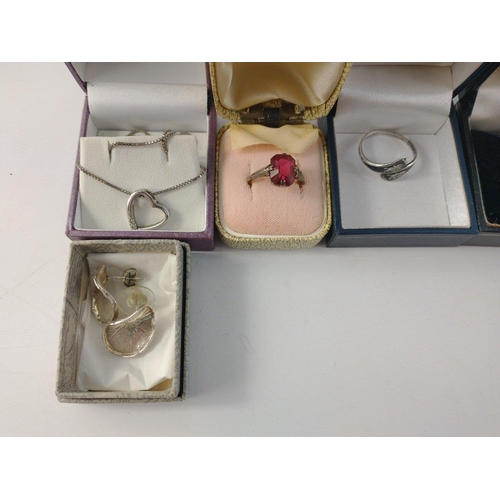 58 - Some nice quality silver boxed jewellery stamped 925 including a baby's bangle, a silver heart penda... 