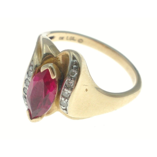 6 - A 10ct stamped yellow gold ring (ring size M/N) with a large oval shaped ruby flanked by 8 small dia... 