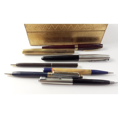 63 - A small collection of pens to include 2 Parkers, and others in a gilt box#63