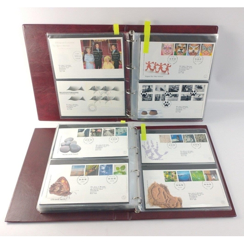 65 - Two well presented albums of ROYAL MAIL First Day Covers. Over 100 covers between 1993 and 2002.  Al... 