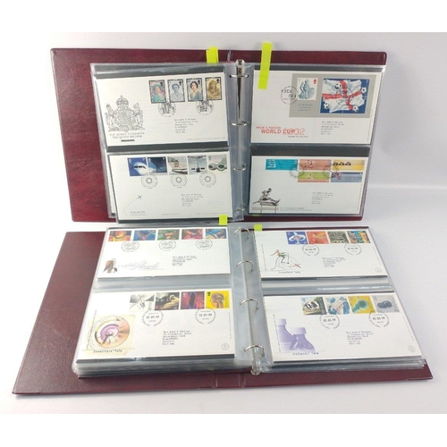 65 - Two well presented albums of ROYAL MAIL First Day Covers. Over 100 covers between 1993 and 2002.  Al... 