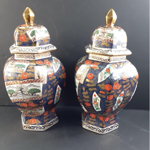 383 - A striking pair of large hand-painted IMARI ginger jars beautifully decorated with lavish gilt highl... 