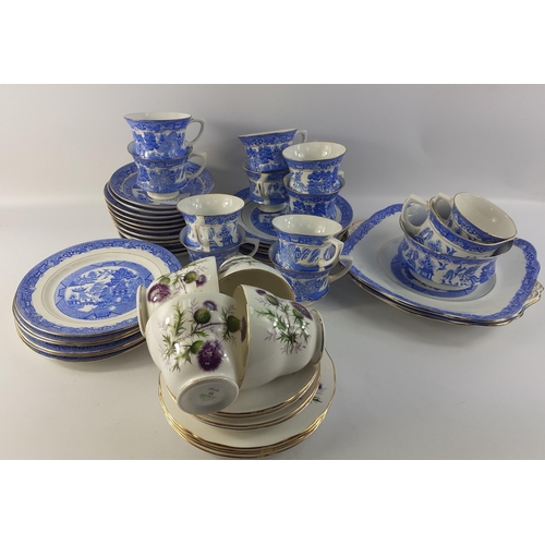 424 - A box containing two part sets.  One in blue and white willow pattern some pieces with damage and th... 