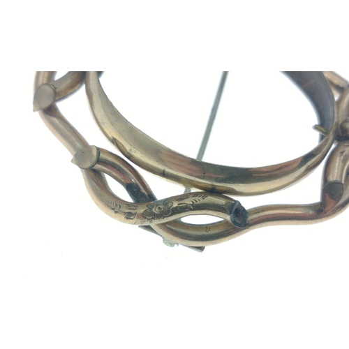 12 - A large unmarked yellow metal plaid brooch with some nice engraving, 60mm x55mm, weight 20.6g approx... 