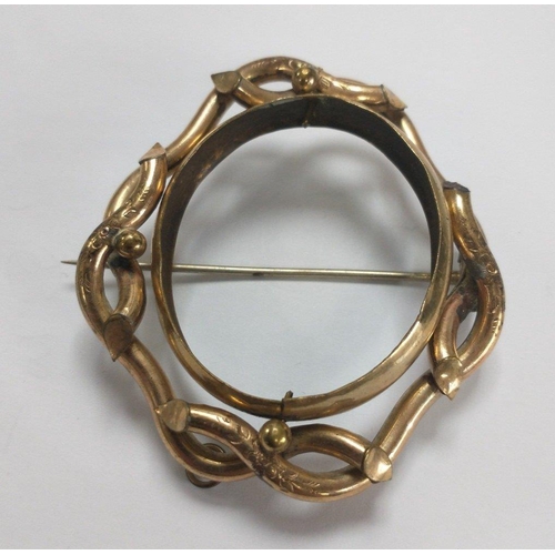 12 - A large unmarked yellow metal plaid brooch with some nice engraving, 60mm x55mm, weight 20.6g approx... 