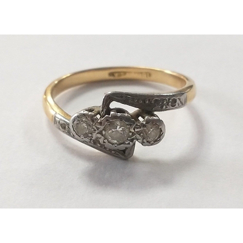 3 - An 18ct yellow gold ring with three centre diamonds.  Size O, 3.47g approx. Centre stone 3mm and fla... 