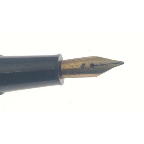 80 - A vintage CONWAY STEWART 15 Fountain pen.  Black barrel with gilt fittings and a 14ct gold nib.  Nic... 