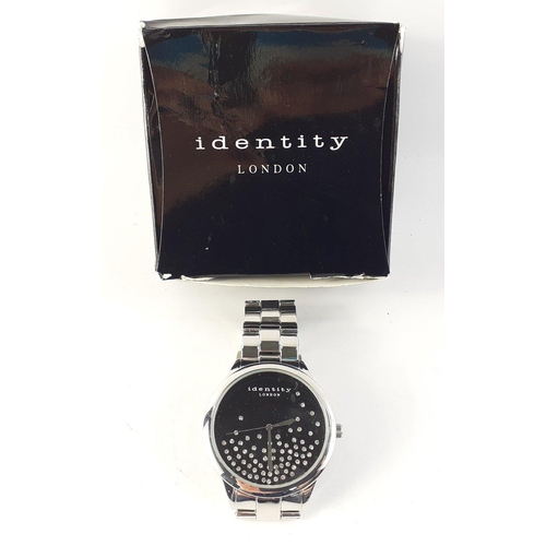 83 - Two timepieces being a reproduction Spirit of St Louis clock and an Identity watch#84