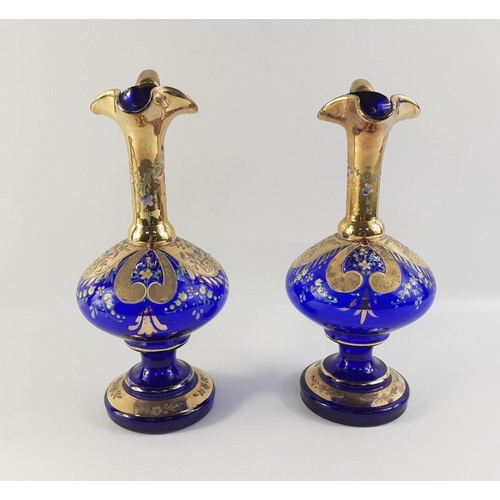 258 - A lovely pair of highly decorated cobalt blue and gilt Bohemian handled vases.  Each standing approx... 