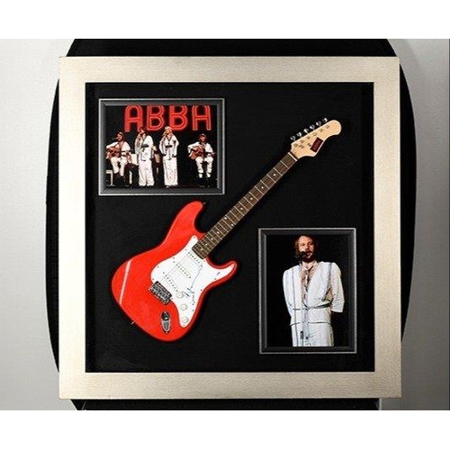 100 - A stunning framed item of ABBA memorabilia which has incorporated within the large box frame a guita... 