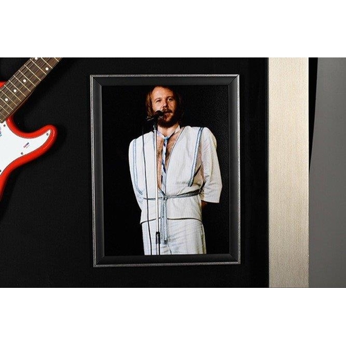 100 - A stunning framed item of ABBA memorabilia which has incorporated within the large box frame a guita... 