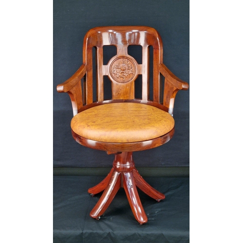 108 - A handmade solid Rosewood swivel chair with hand carving. The feet have castors and the swivel mecha... 