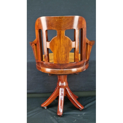 108 - A handmade solid Rosewood swivel chair with hand carving. The feet have castors and the swivel mecha... 