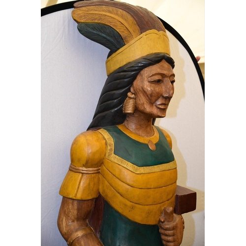 109 - A very heavy and large hand carved solid wooden Indian with hand coloured detailing. Please check th... 