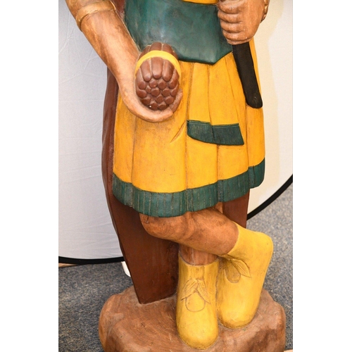 109 - A very heavy and large hand carved solid wooden Indian with hand coloured detailing. Please check th... 