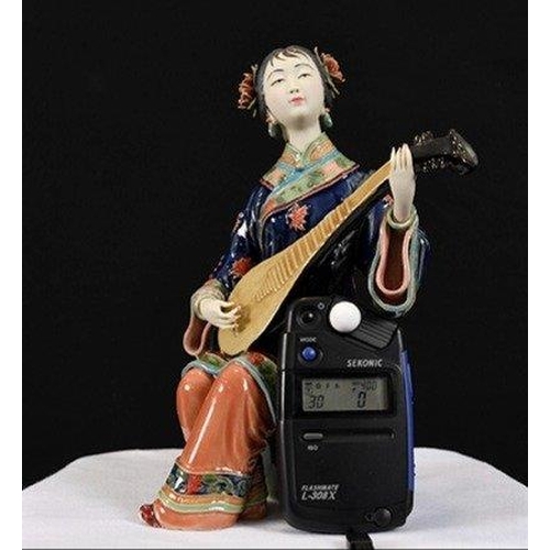 114 - An original hand made Shiwan Oriental Geisha Lady made from very fine porcelain. This exquisite piec... 