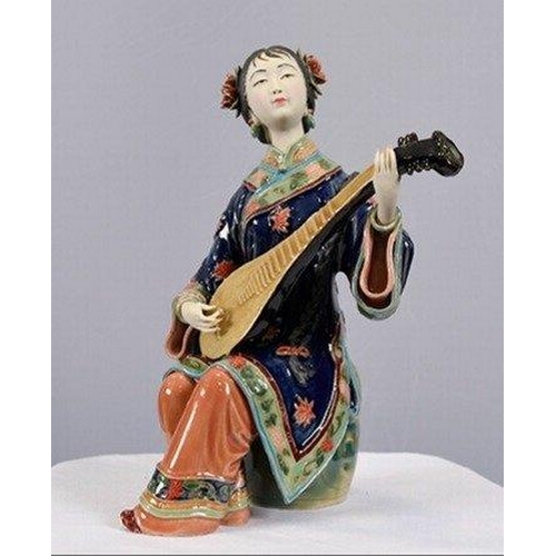 114 - An original hand made Shiwan Oriental Geisha Lady made from very fine porcelain. This exquisite piec... 