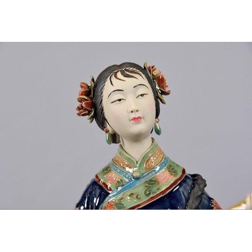 114 - An original hand made Shiwan Oriental Geisha Lady made from very fine porcelain. This exquisite piec... 