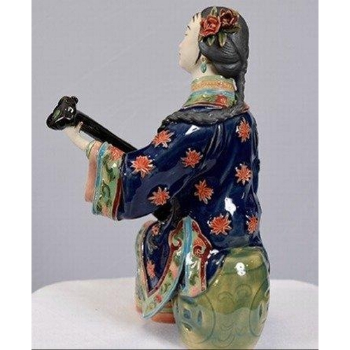 114 - An original hand made Shiwan Oriental Geisha Lady made from very fine porcelain. This exquisite piec... 