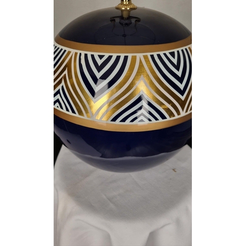 119 - A porcelain blue and cream hand painted lamp with gold embossed detail. Display shade shown supplied... 