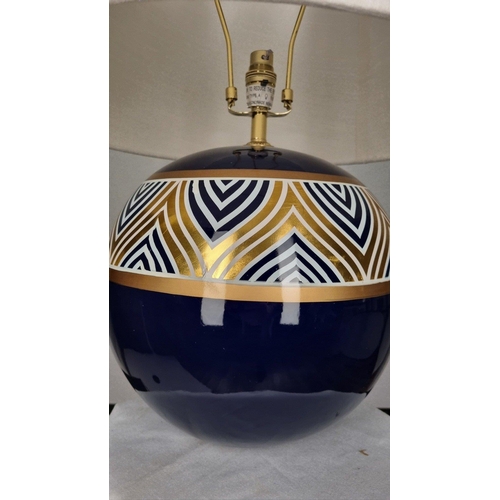 119 - A porcelain blue and cream hand painted lamp with gold embossed detail. Display shade shown supplied... 