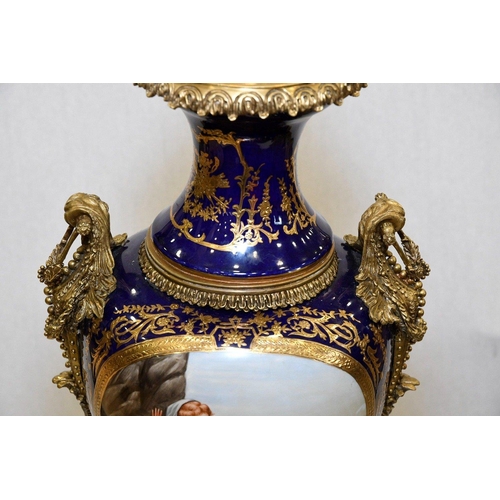 127 - A hand made Chinese porcelain trophy vase with high grade painting and gold detailed finish. Origin ... 