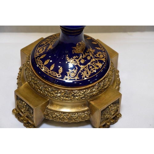 127 - A hand made Chinese porcelain trophy vase with high grade painting and gold detailed finish. Origin ... 