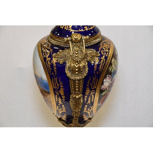 127 - A hand made Chinese porcelain trophy vase with high grade painting and gold detailed finish. Origin ... 