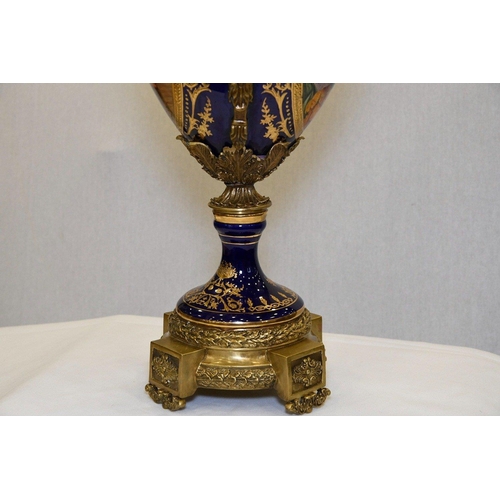 127 - A hand made Chinese porcelain trophy vase with high grade painting and gold detailed finish. Origin ... 