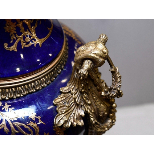 128 - A hand made Chinese porcelain trophy vase with high grade painting and gold detailed finish. Origin ... 