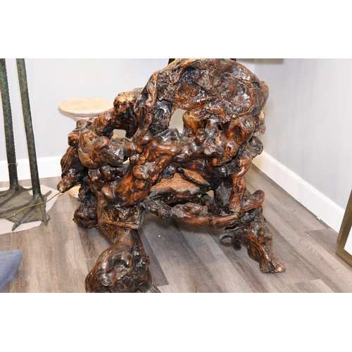 14 - A unique piece of furniture that has been hand made from old tree roots. It has been beautifully scu... 