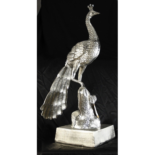 145 - A very large highly polished aluminium Peacock on base. A wonderfully unusual piece with good detail... 