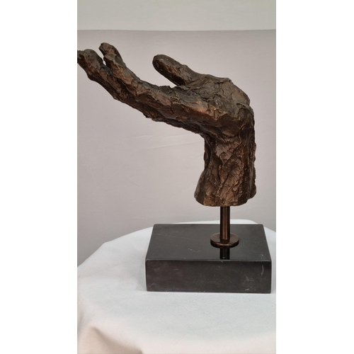 149 - A bronze casting of a hand with well sculpted rough detail finish set in a solid marble base. H: 27c... 