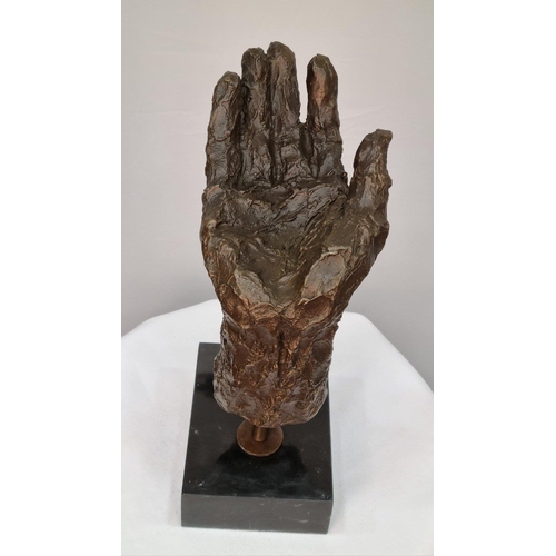 149 - A bronze casting of a hand with well sculpted rough detail finish set in a solid marble base. H: 27c... 