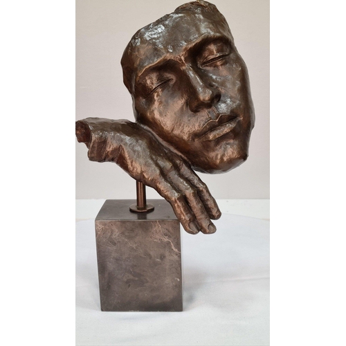 150 - A bronze sculpture of a face on solid marble base. H: 40cm  W: 27cm  D: 15cm#150